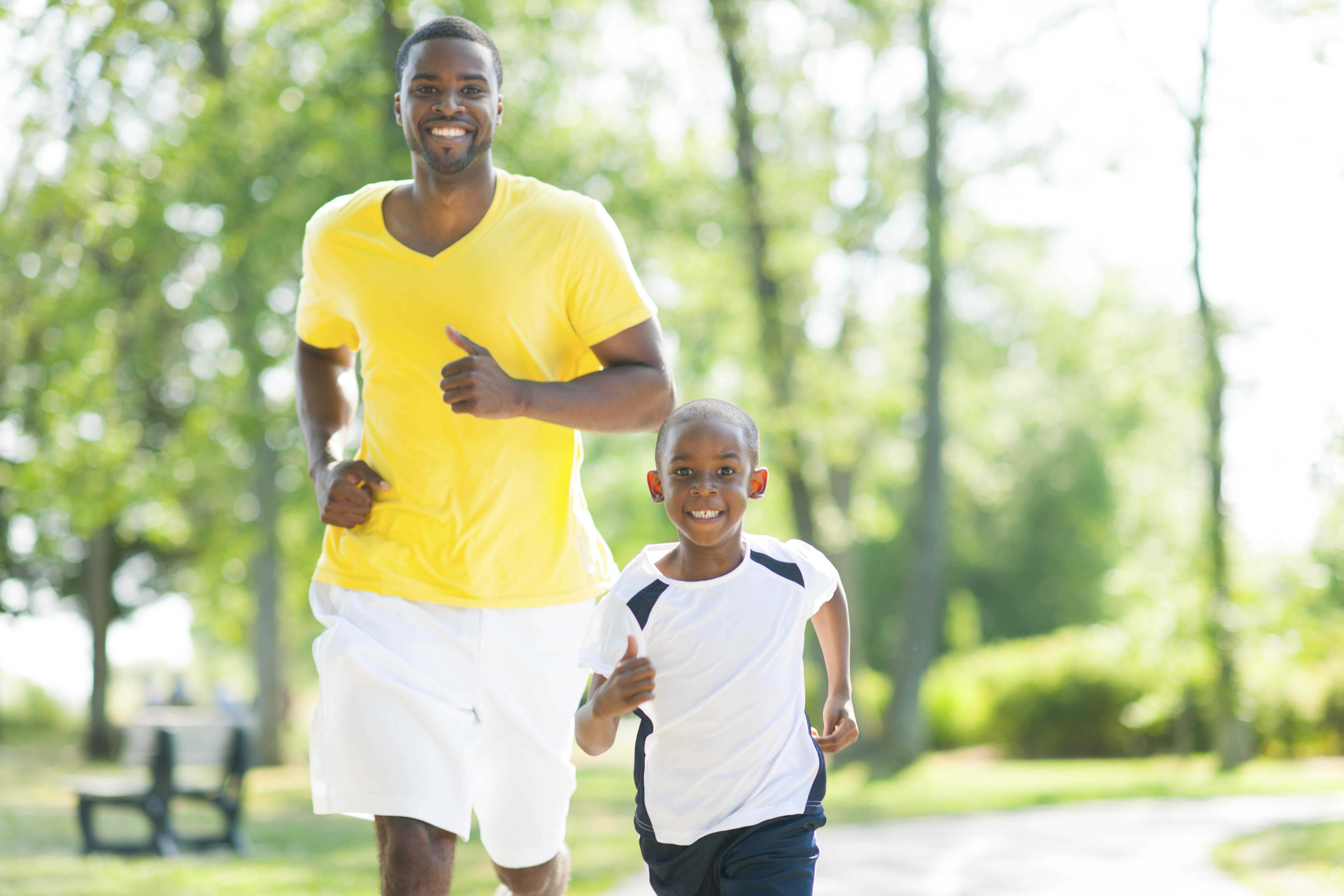 Father and son jogging together.