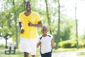 Father and son jogging together.