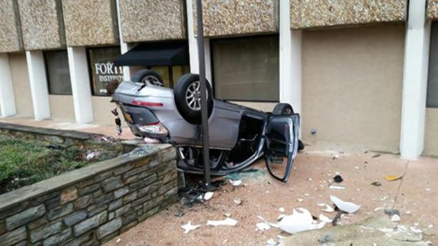 Car falls 4 stories
