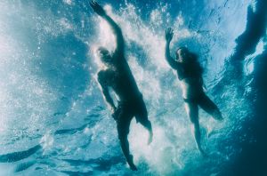 Two people swimming in Lake Tahoe, California