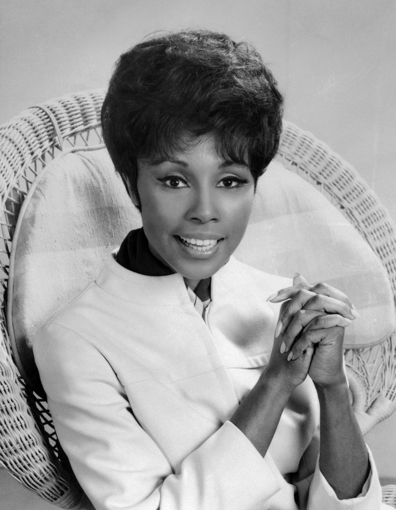 Diahann Carroll Sitting with Hands Clasped
