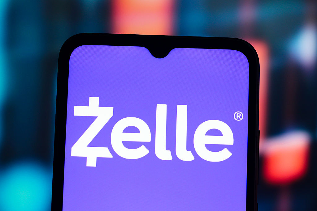In this photo illustration, the Zelle logo is seen displayed...