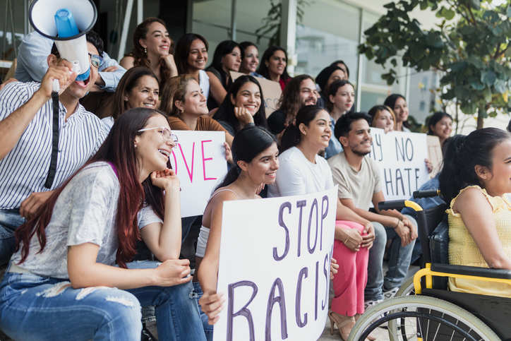 Latin people protesting on streets for Human Rights and stop racism in Mexico Latin America. Group of Hispanic women and men together for peace and equality