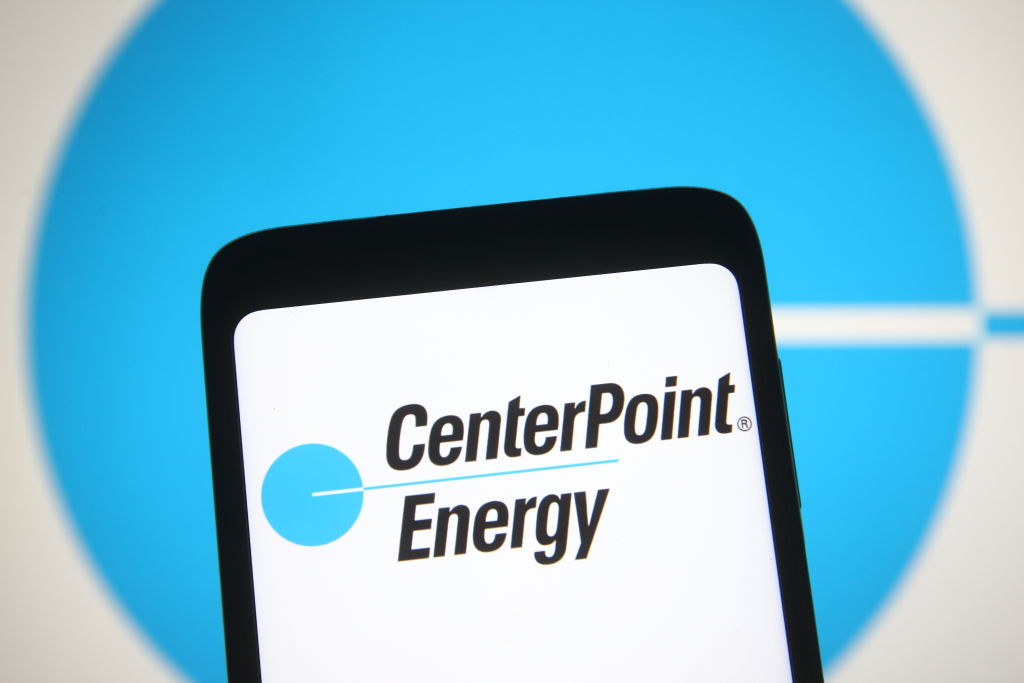 In this photo illustration, a CenterPoint Energy logo seen...