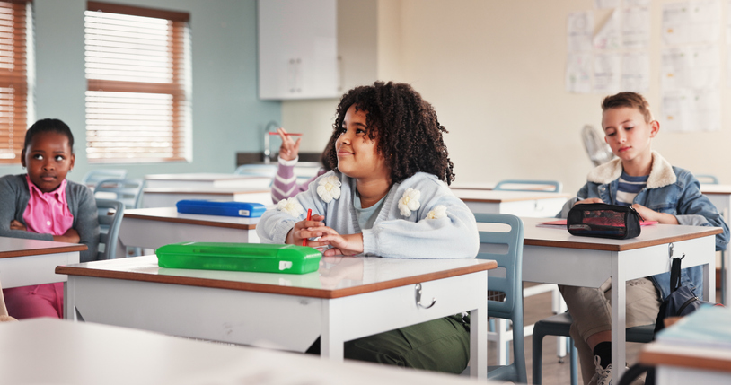 Classroom, students and listening for education, school and learning for young group in junior grade. Lecture, growth and children with knowledge, scholarship and development to prepare in academy